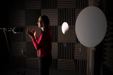 A woman standing in a sound lab