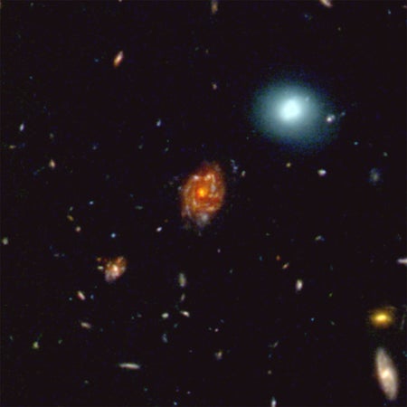 This JWST image shows the Big Wheel galaxy (in the center) and its cosmic environment