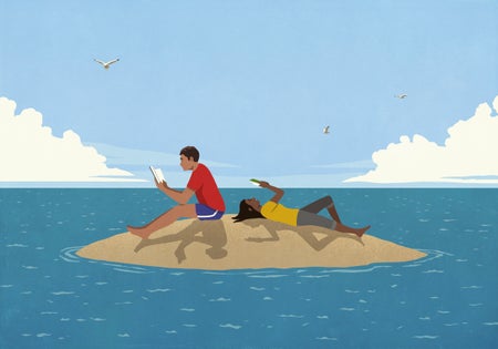 Couple reading books on sunny remote ocean island