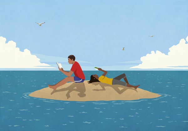 Couple reading books on sunny remote ocean island