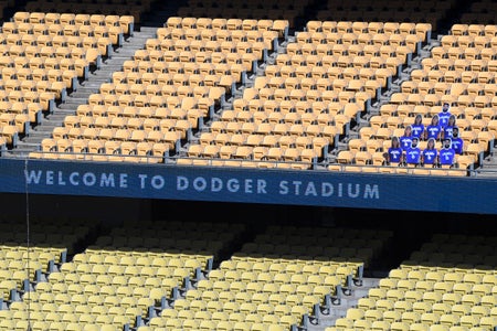 Dodger Stadium with cutouts of fans in seats