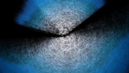 A blue, black and white animation of points emanating in two cones from a center point.