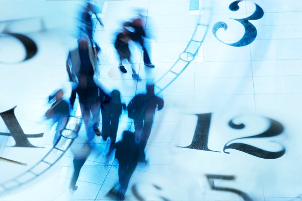 A montage of blurred pedestrians walking and a multitude of clock faces.