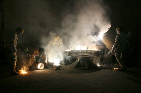 Men work inside of an uranium conversion facility just outside the city of Isfahan, Iran