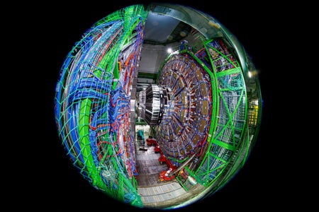 A photograph using a fish-eye lens shows the Compact Muon Solenoid (CMS) detector assembly in a tunnel of the Large Hadron Collider (LHC) at the European Organization for Nuclear Research (CERN)