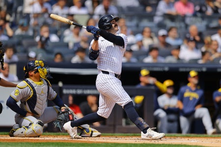 New York Yankees' Austin Wells as he swung and hit a home run with a torpedo bat over his shoulder