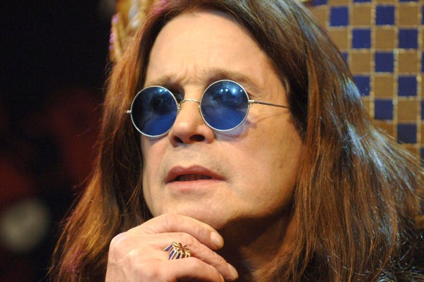 Ozzy Osborne with round blue glasses