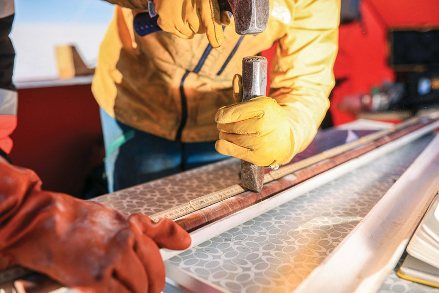 Scientists separating rock core
