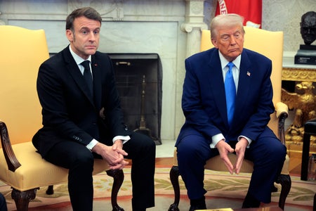 President Donald Trump (right) sitting with French President Emmanuel Macron (left) in the Oval Office