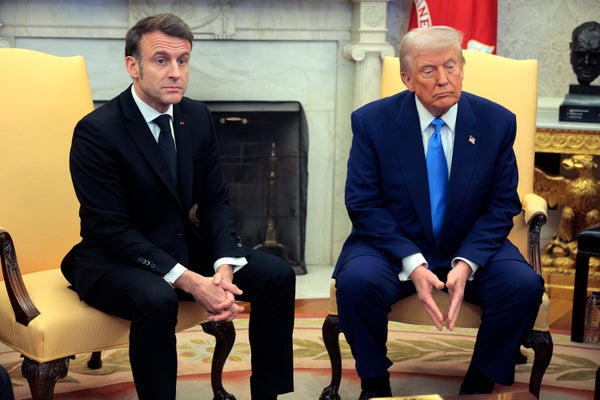 President Donald Trump (right) sitting with French President Emmanuel Macron (left) in the Oval Office