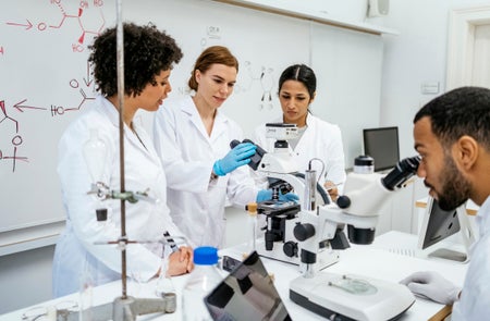 4 STEM students at a University lab