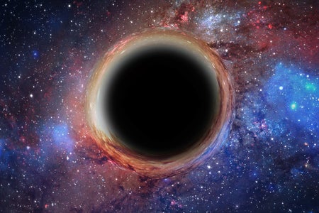 3D rendering of a supermassive black hole, in the foreground against a galaxy and starry sky