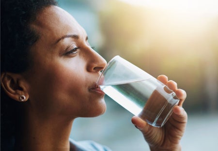 Woman drinking from a glass of water
